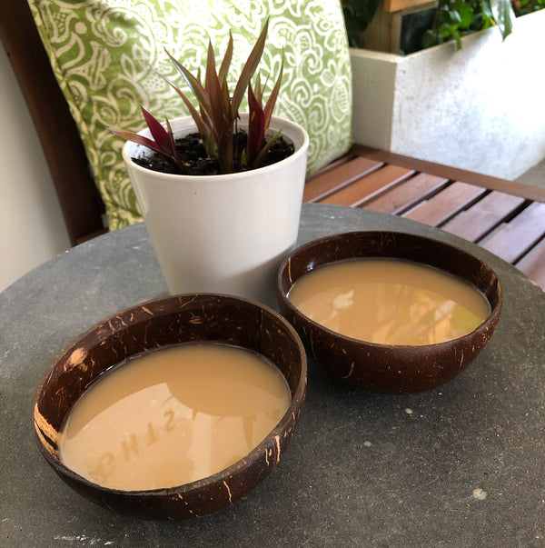 two coconut shells of kava